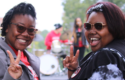 Thumbnail image: Two students at the "Party in the Park"