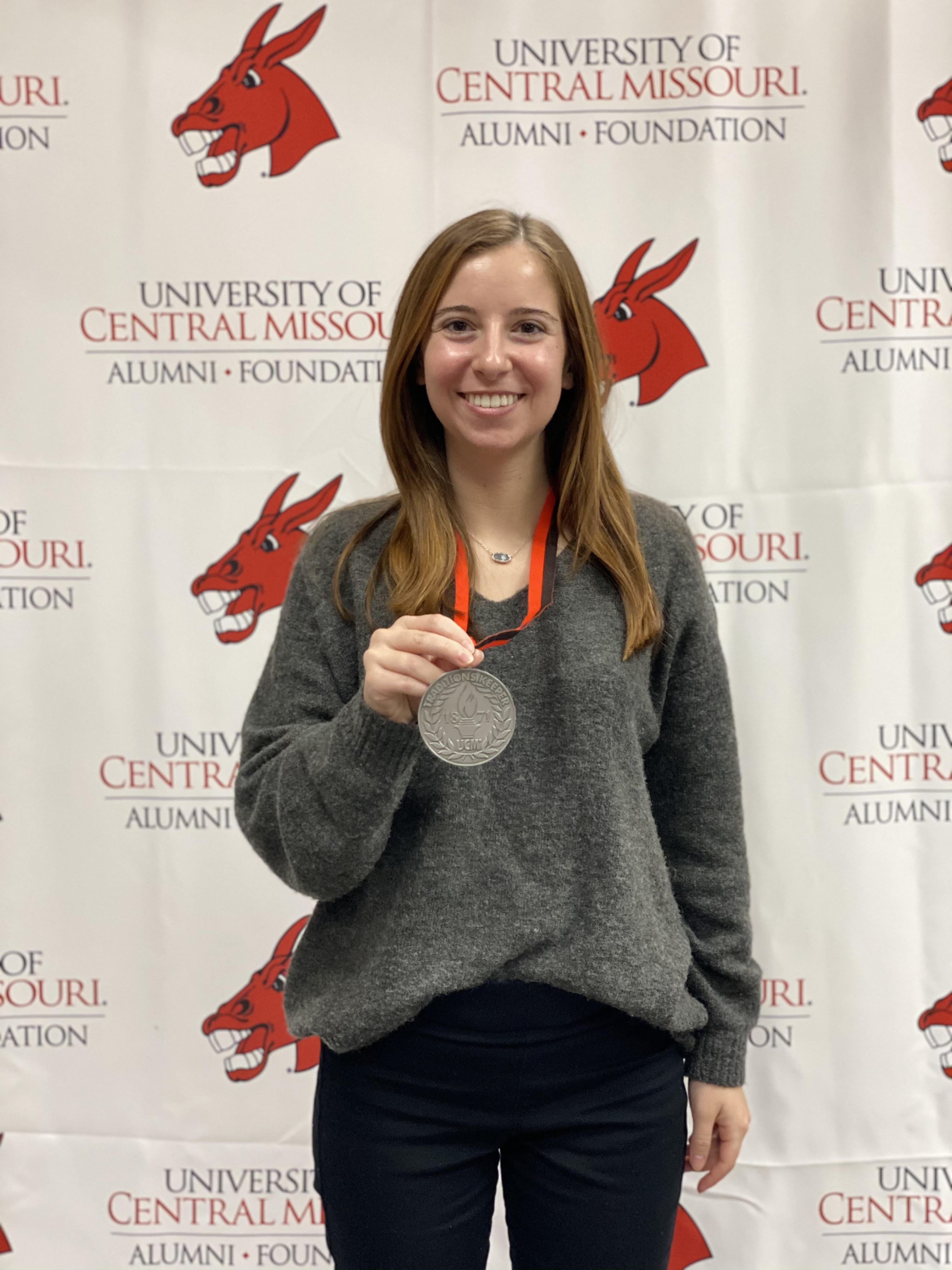 student wearing a traditions keeper medallion